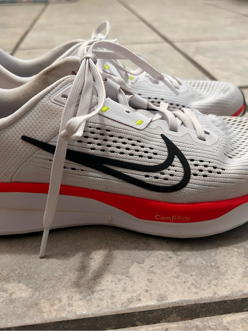 Nike Women’s White Athletic Shoes with Black Swoosh and Red Midsole